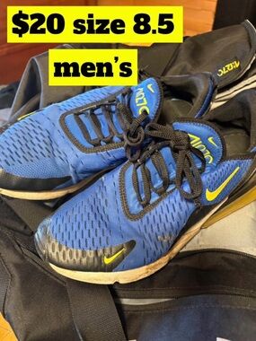 Nike blue running shoes with yellow Swoosh